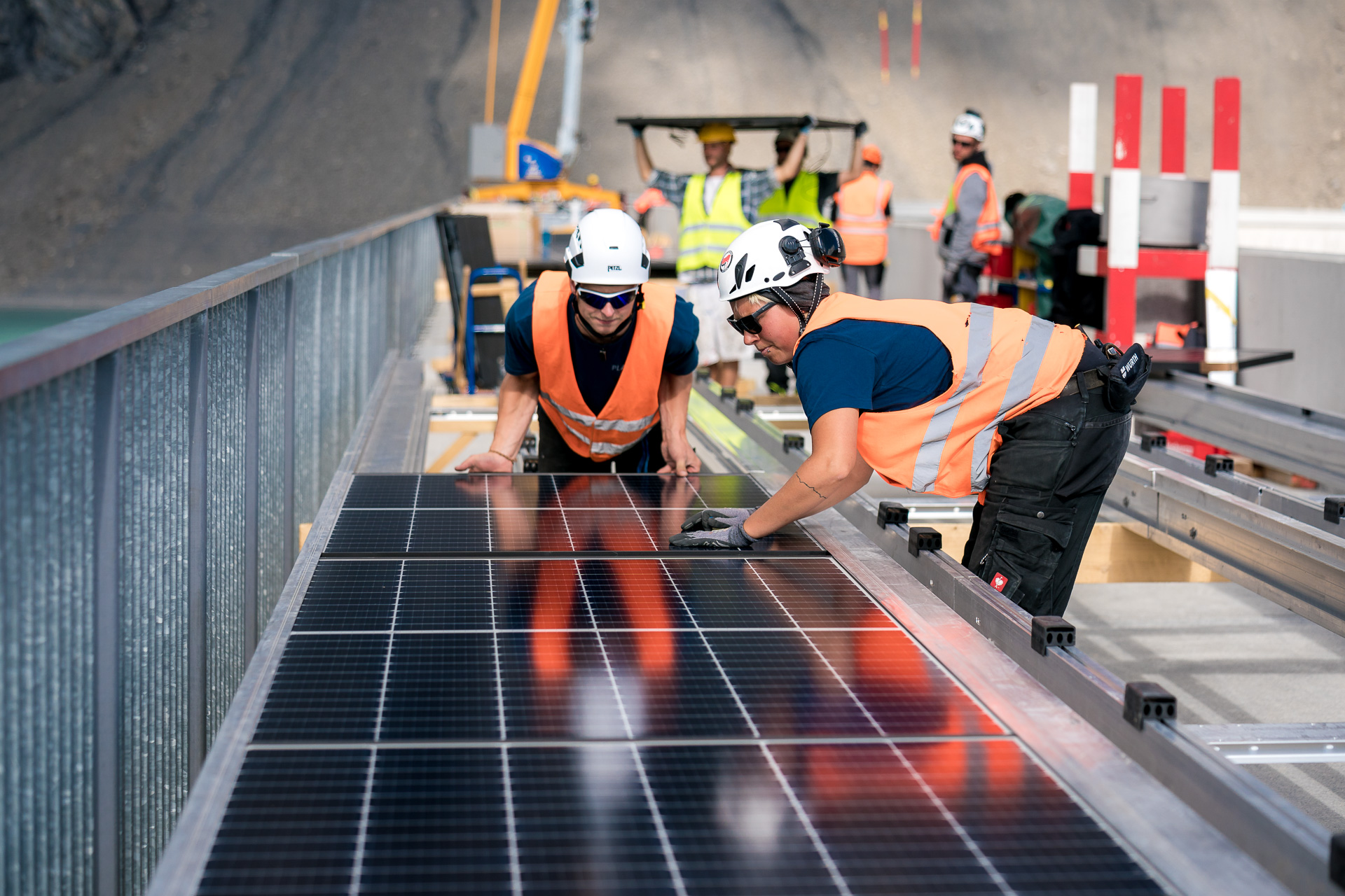 The modules were prepared in solar tables and then hoisted onto the wall by crane.